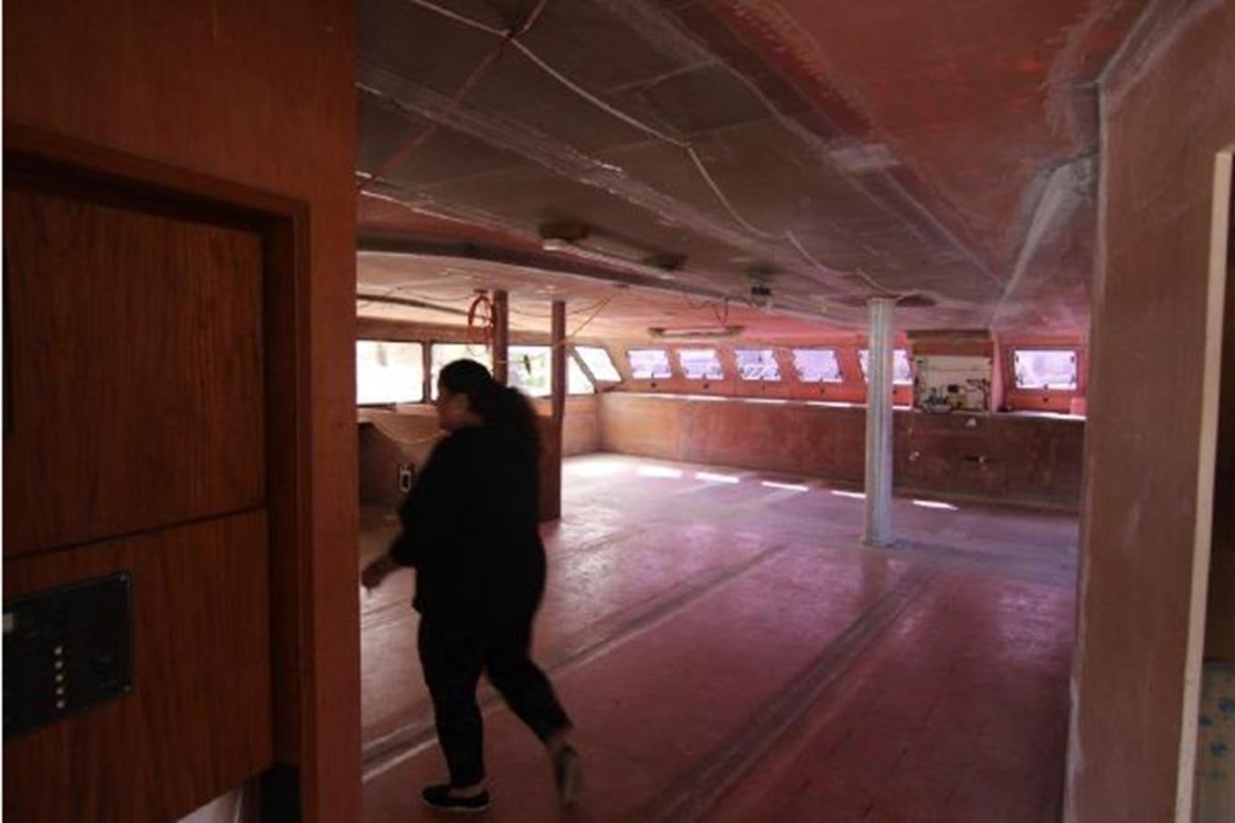 a person walking in a building aboard 2023 PDIGREE CAT BLOOMFIELD Yacht for Sale