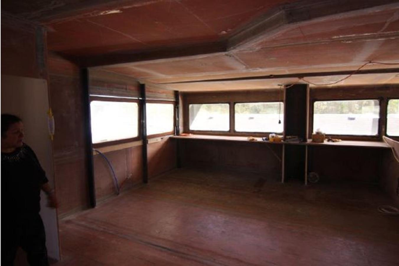 a person standing in a room aboard 2023 PDIGREE CAT BLOOMFIELD Yacht for Sale