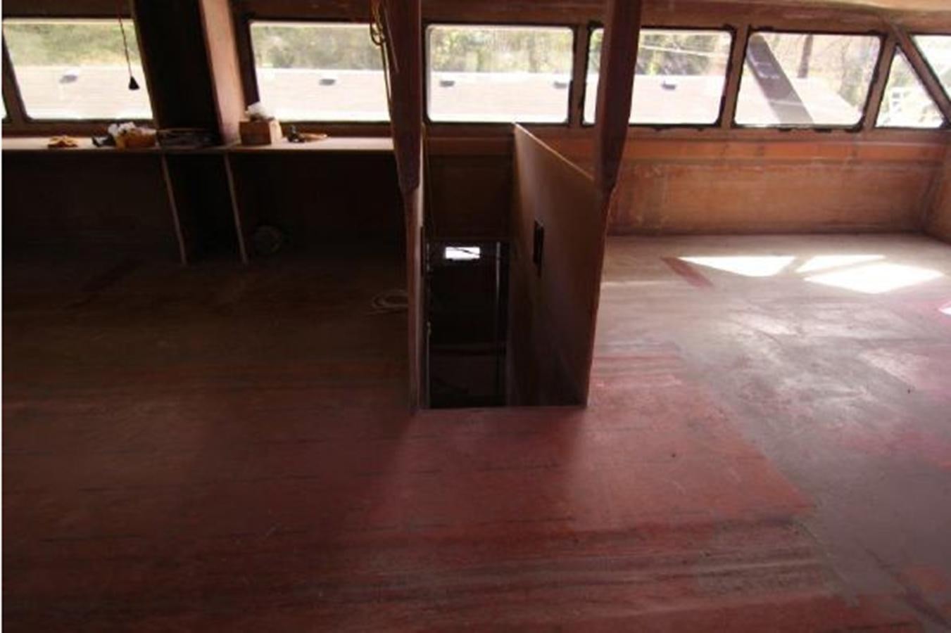 a room with a wood floor and a window with a door open aboard 2023 PDIGREE CAT BLOOMFIELD Yacht for Sale