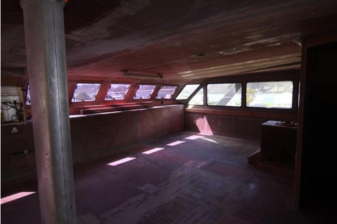 a room with a red car aboard 2023 PDIGREE CAT BLOOMFIELD Yacht for Sale