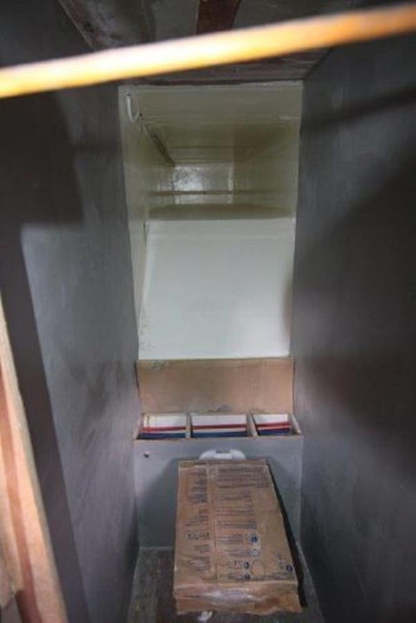 a room with a shelf and a shelf with books on it aboard 2023 PDIGREE CAT BLOOMFIELD Yacht for Sale