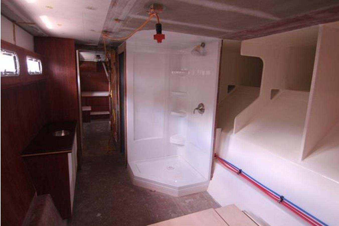 a shower in a room aboard 2023 PDIGREE CAT BLOOMFIELD Yacht for Sale