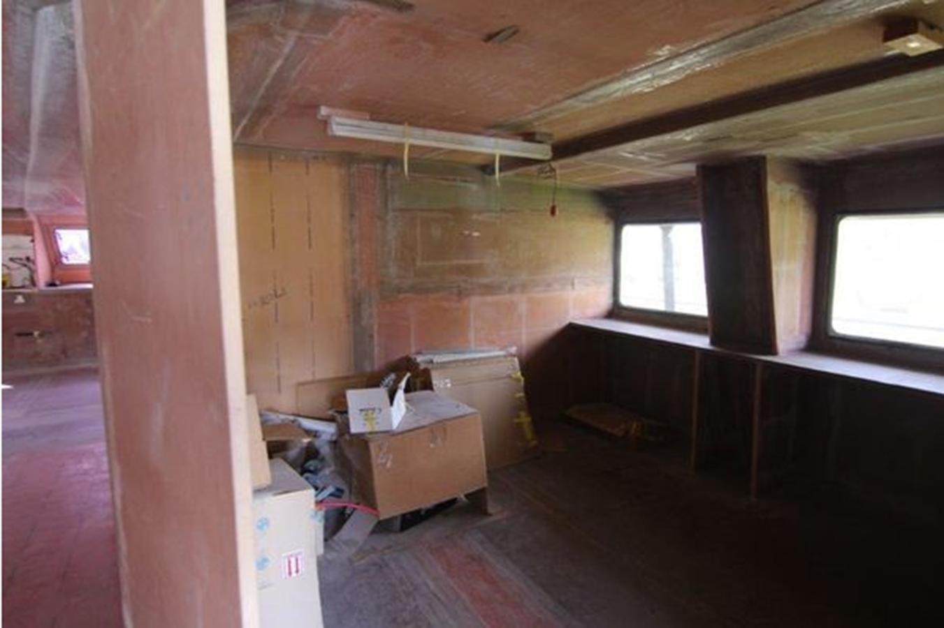 a room with a wood floor and a window with a wood ceiling aboard 2023 PDIGREE CAT BLOOMFIELD Yacht for Sale