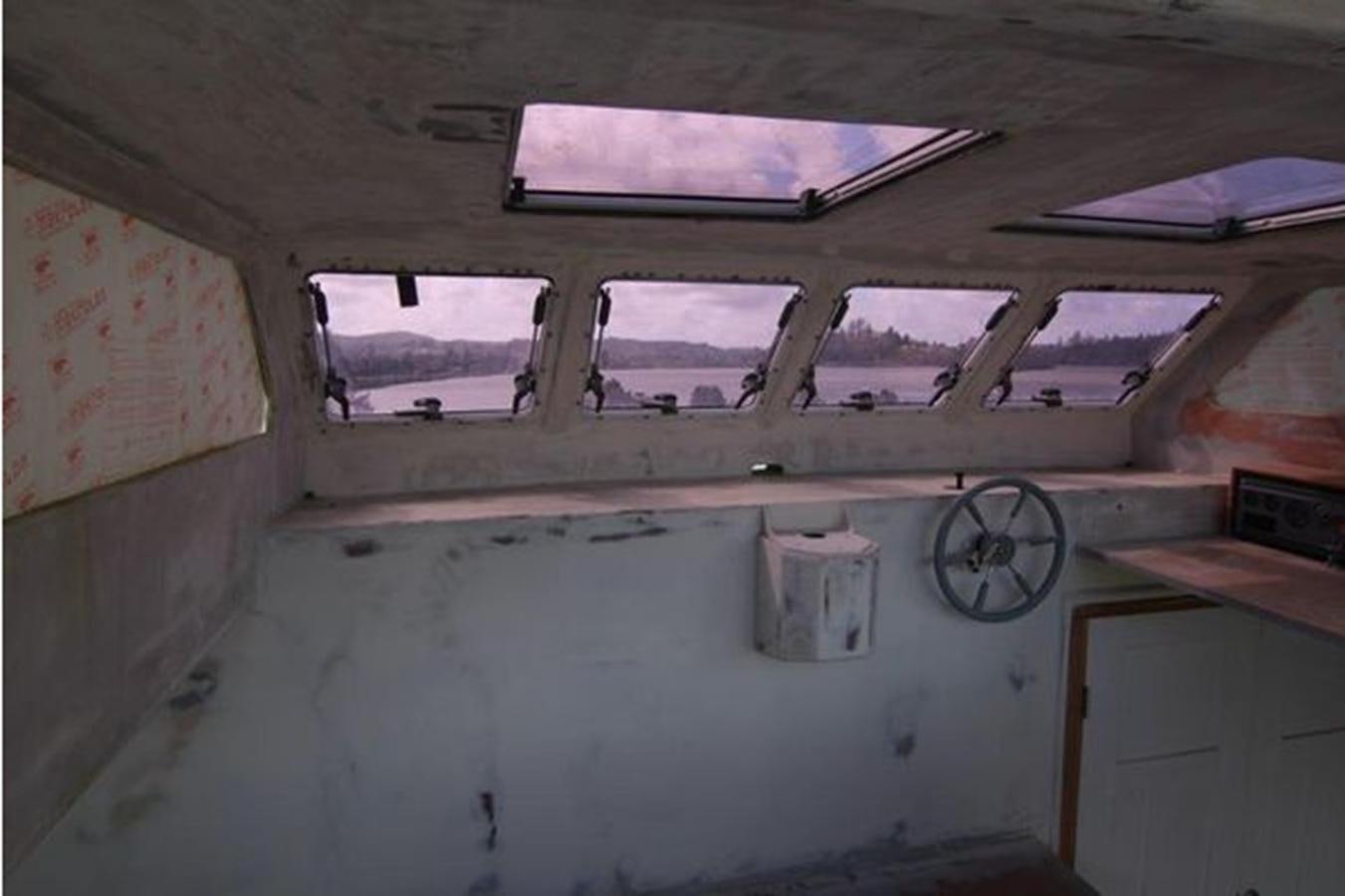 a room with a window and a clock aboard 2023 PDIGREE CAT BLOOMFIELD Yacht for Sale