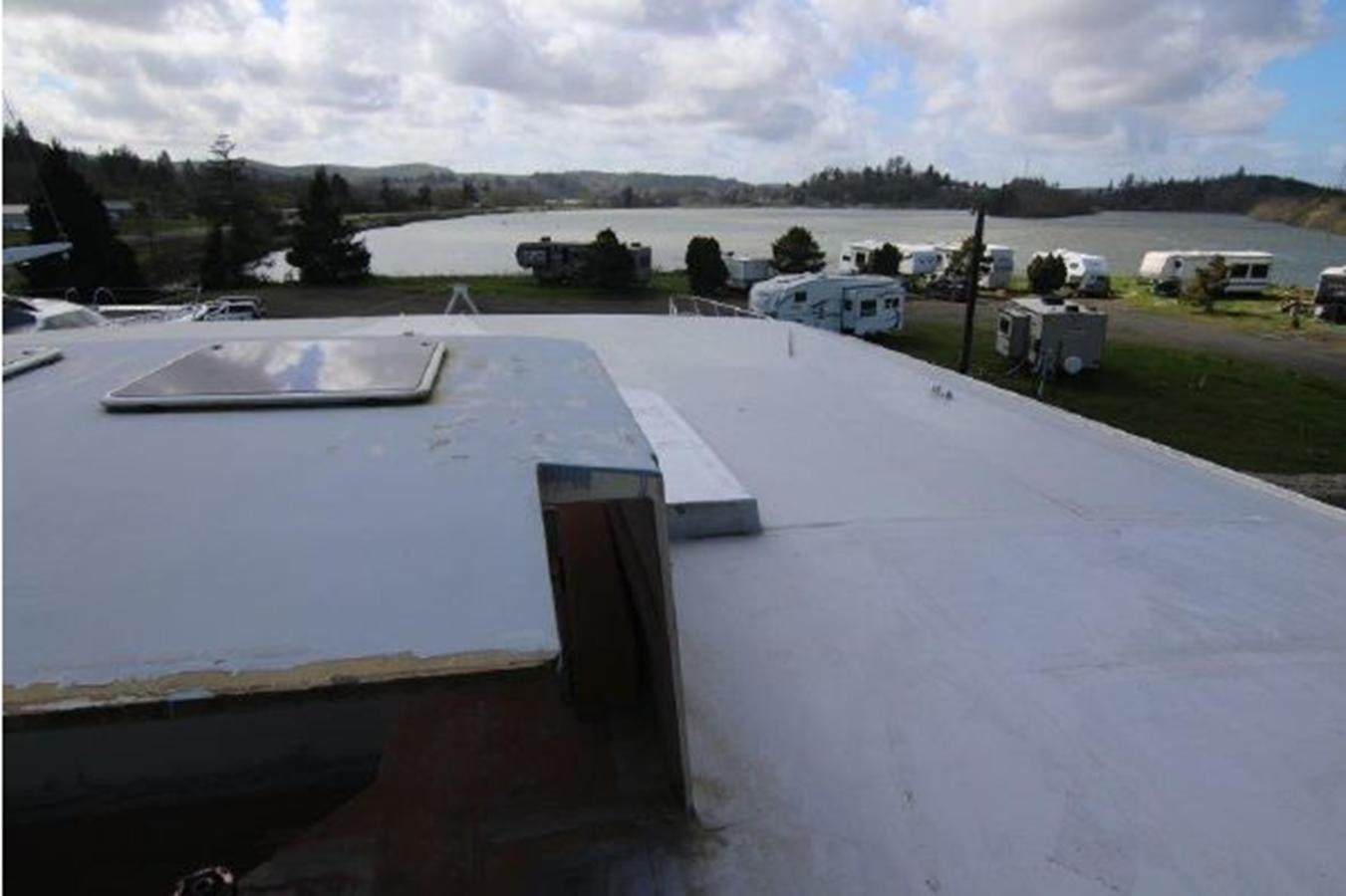 a roof with a hole in the roof aboard 2023 PDIGREE CAT BLOOMFIELD Yacht for Sale
