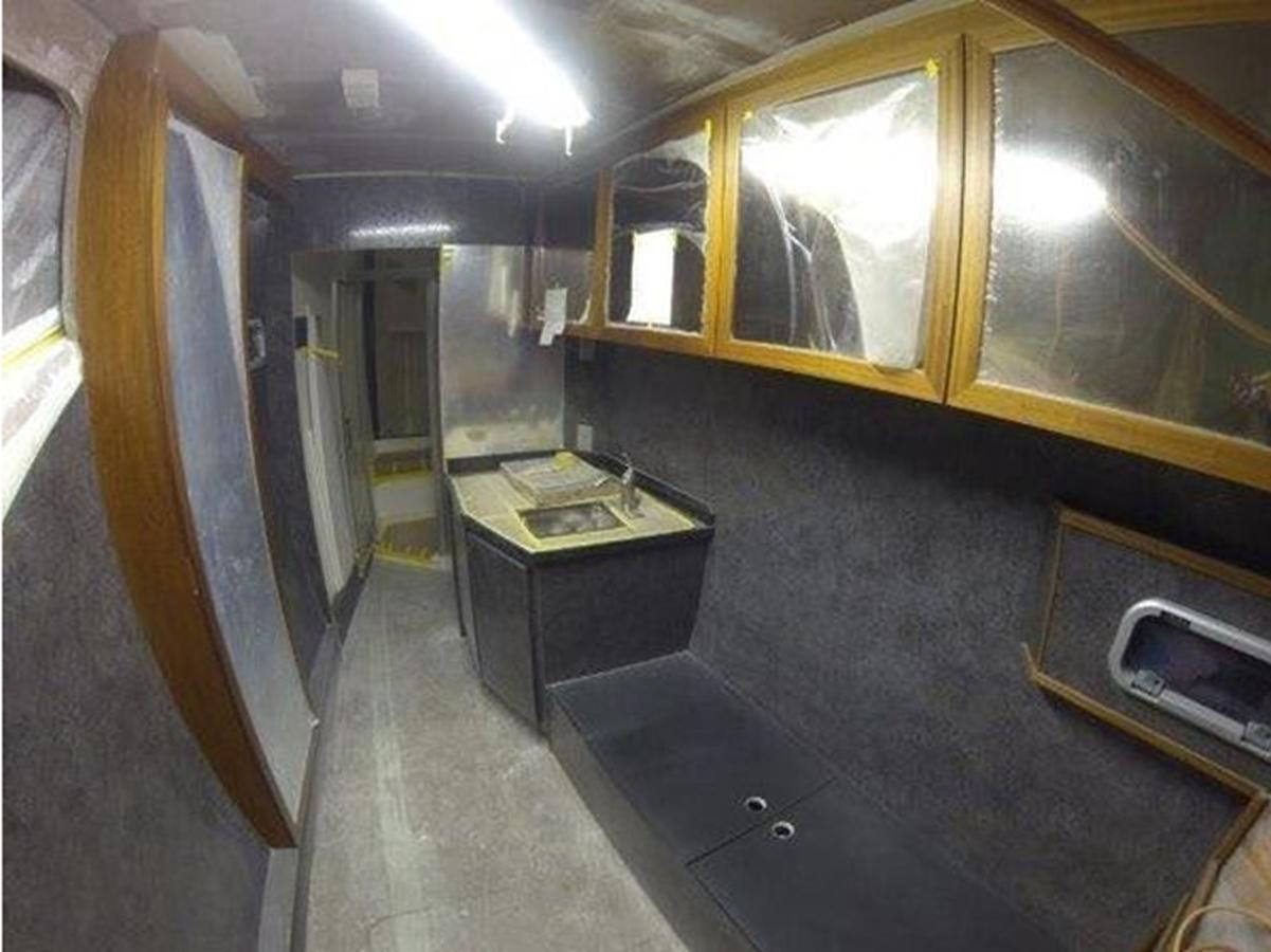 a room with a desk and a computer aboard 2023 PDIGREE CAT BLOOMFIELD Yacht for Sale