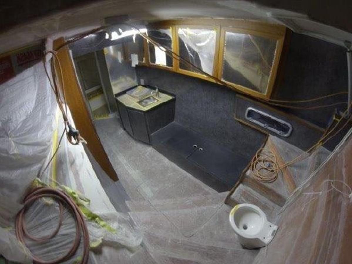 a room with a table and a chair aboard 2023 PDIGREE CAT BLOOMFIELD Yacht for Sale