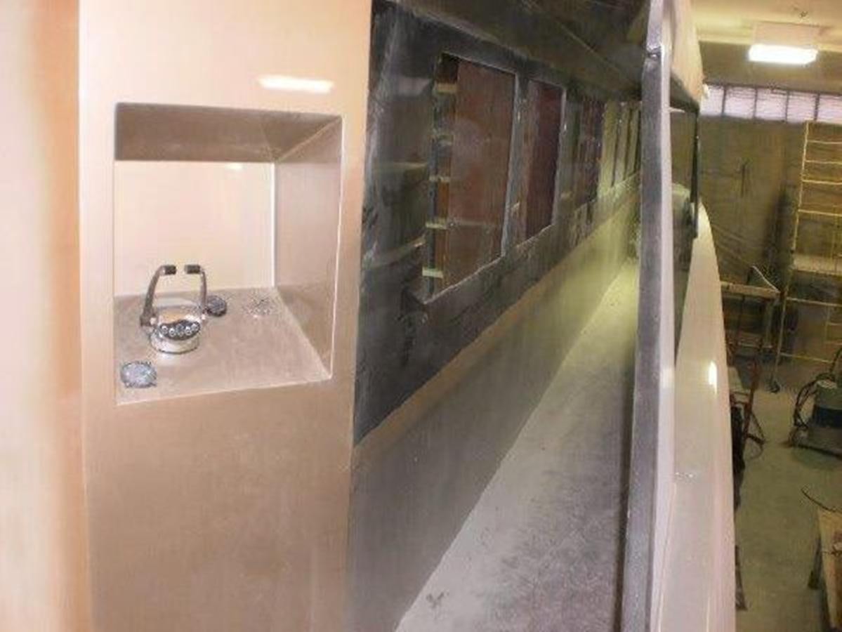 a bathroom with a sink and a mirror aboard 2023 PDIGREE CAT BLOOMFIELD Yacht for Sale