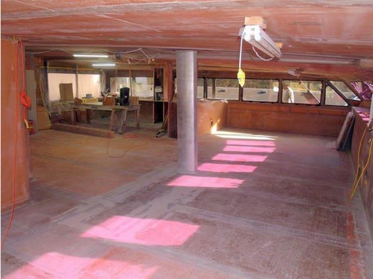 a room with a red floor and a white ceiling aboard 2023 PDIGREE CAT BLOOMFIELD Yacht for Sale