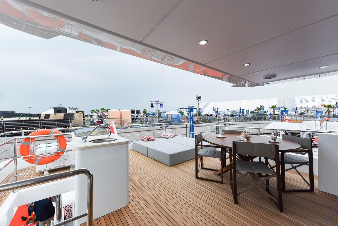 a large room with tables and chairs aboard SG Yacht for Sale