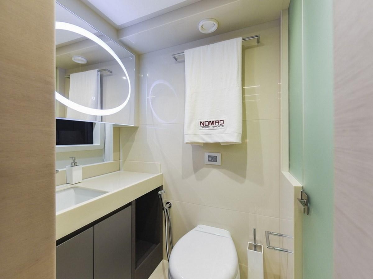 a bathroom with a toilet and a sink aboard SG Yacht for Sale