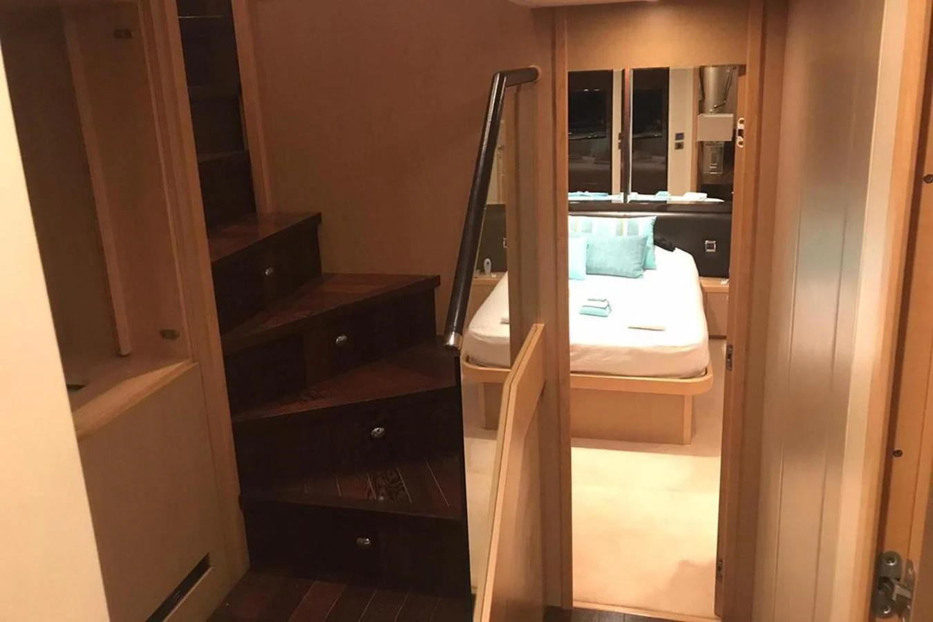 a room with a bed and a desk aboard PRINCESS I Yacht for Sale