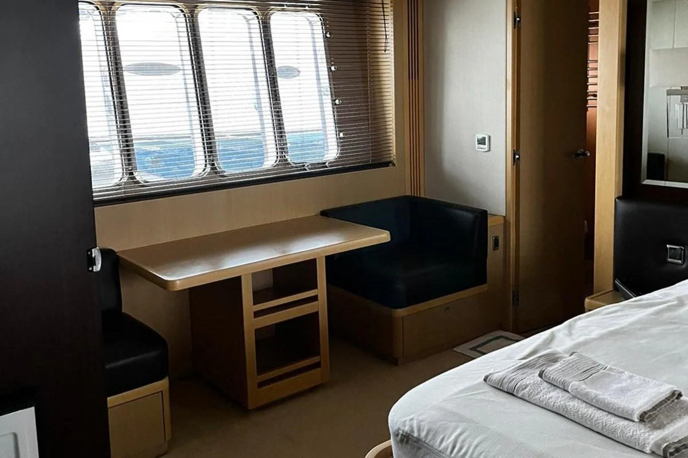 a bed and desk in a room aboard PRINCESS I Yacht for Sale