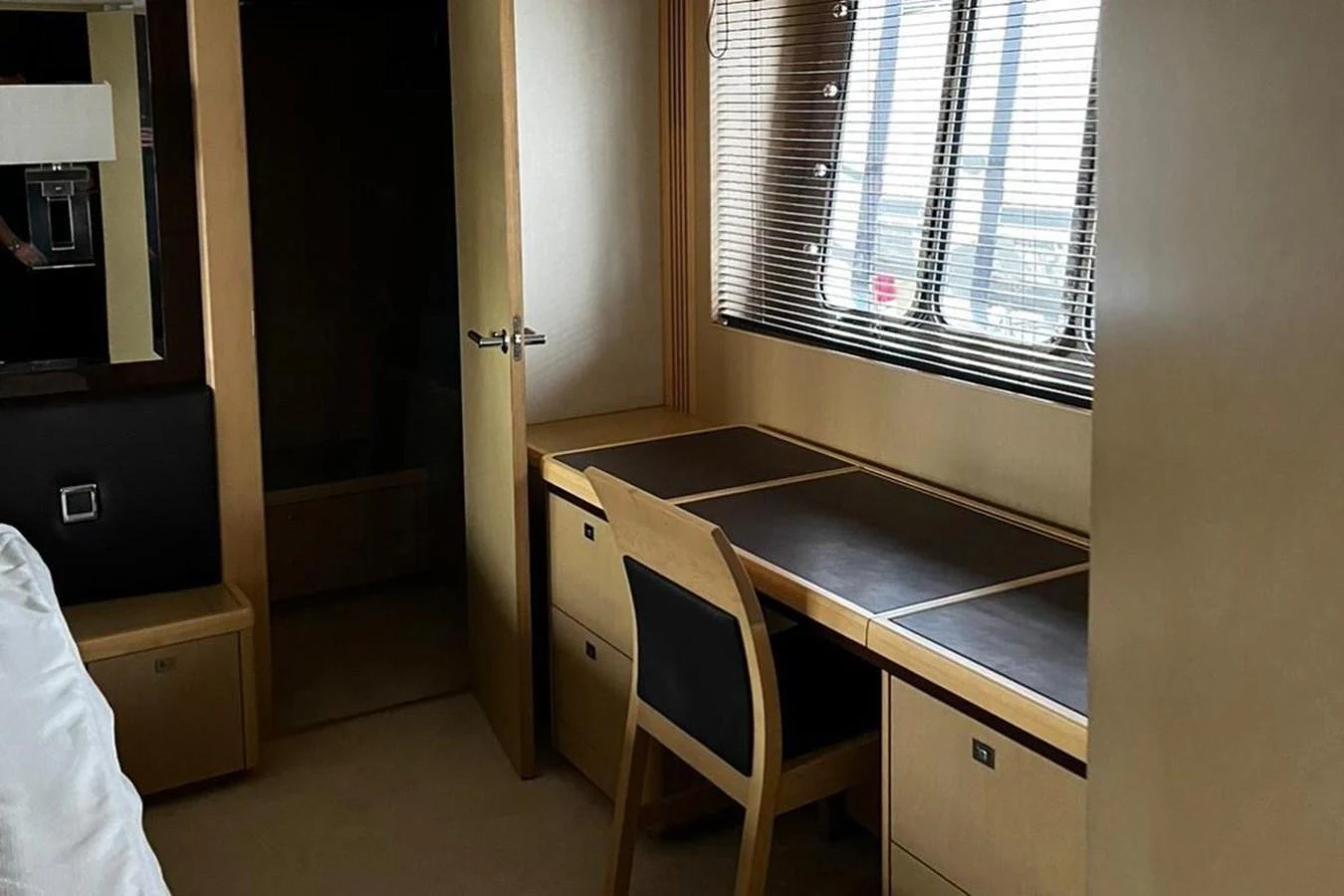 a room with a table and a window aboard PRINCESS I Yacht for Sale