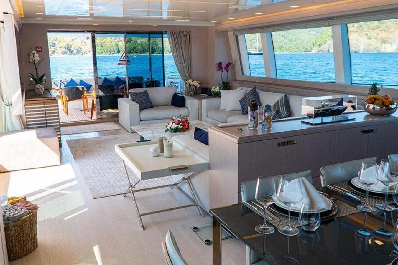 a kitchen with a table and chairs aboard CUSTOM LINE  97 Yacht for Sale