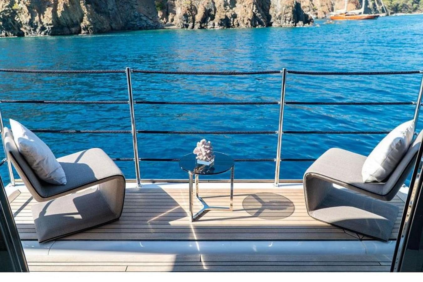 chairs on a dock aboard CUSTOM LINE  97 Yacht for Sale