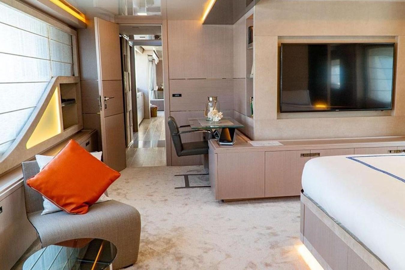 a room with a bed and a television aboard CUSTOM LINE  97 Yacht for Sale