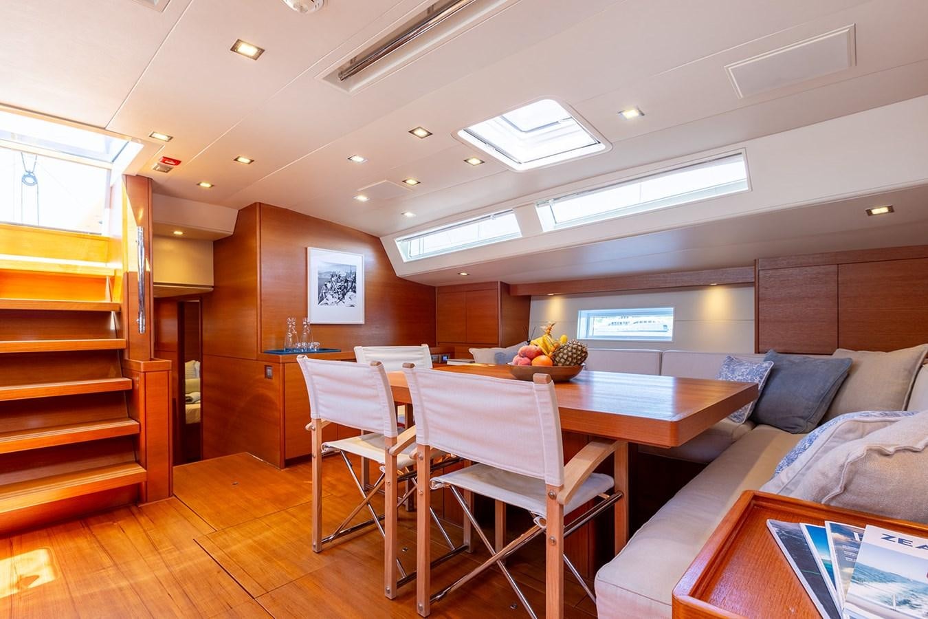 a room with a table and chairs aboard FRIDAY Yacht for Sale