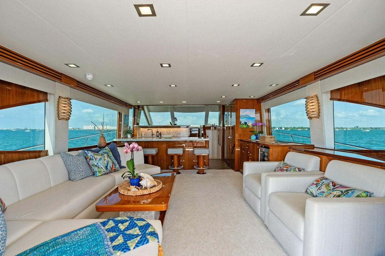 a living room with a large window aboard MANA Yacht for Sale