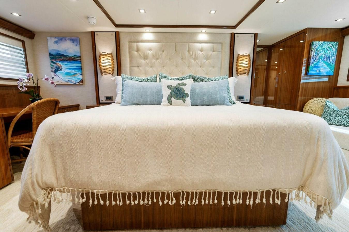 a bed with a white sheet aboard MANA Yacht for Sale