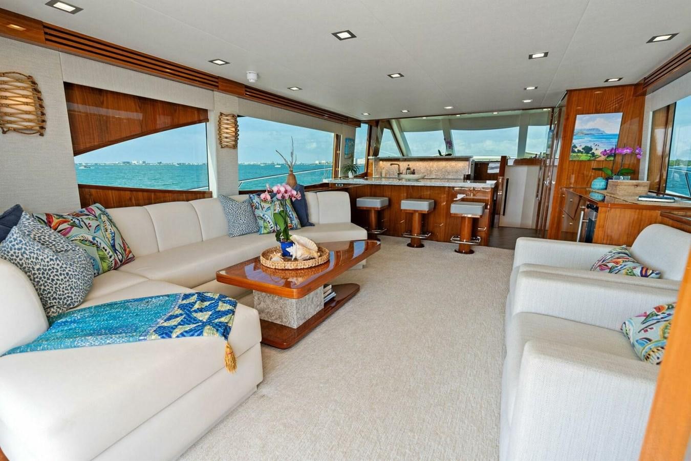 a living room with a large window aboard MANA Yacht for Sale