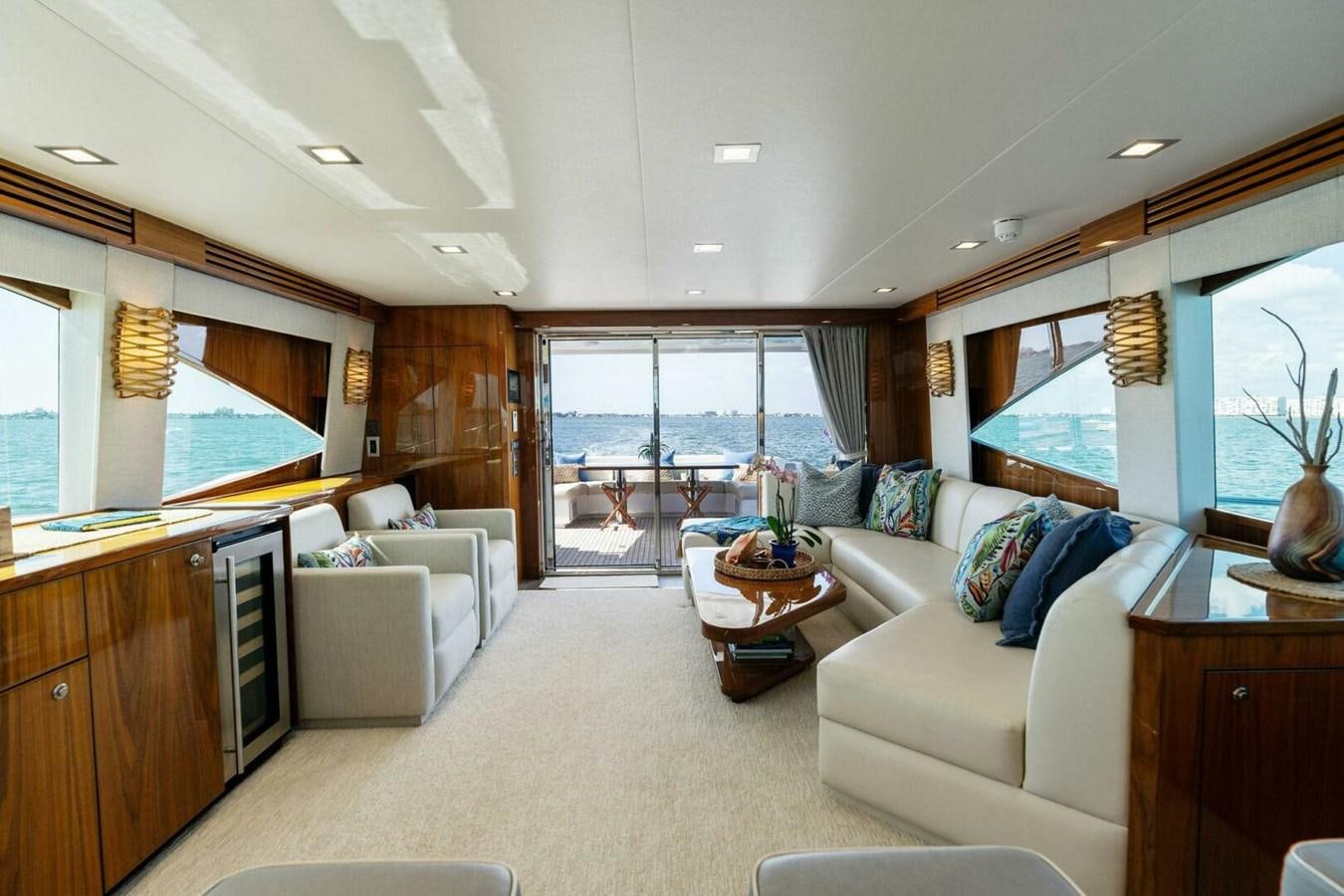 a living room with a large window aboard MANA Yacht for Sale