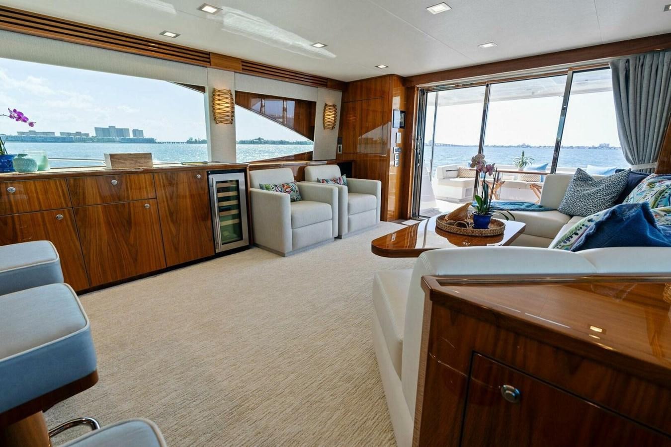 a large living room with a large window aboard MANA Yacht for Sale