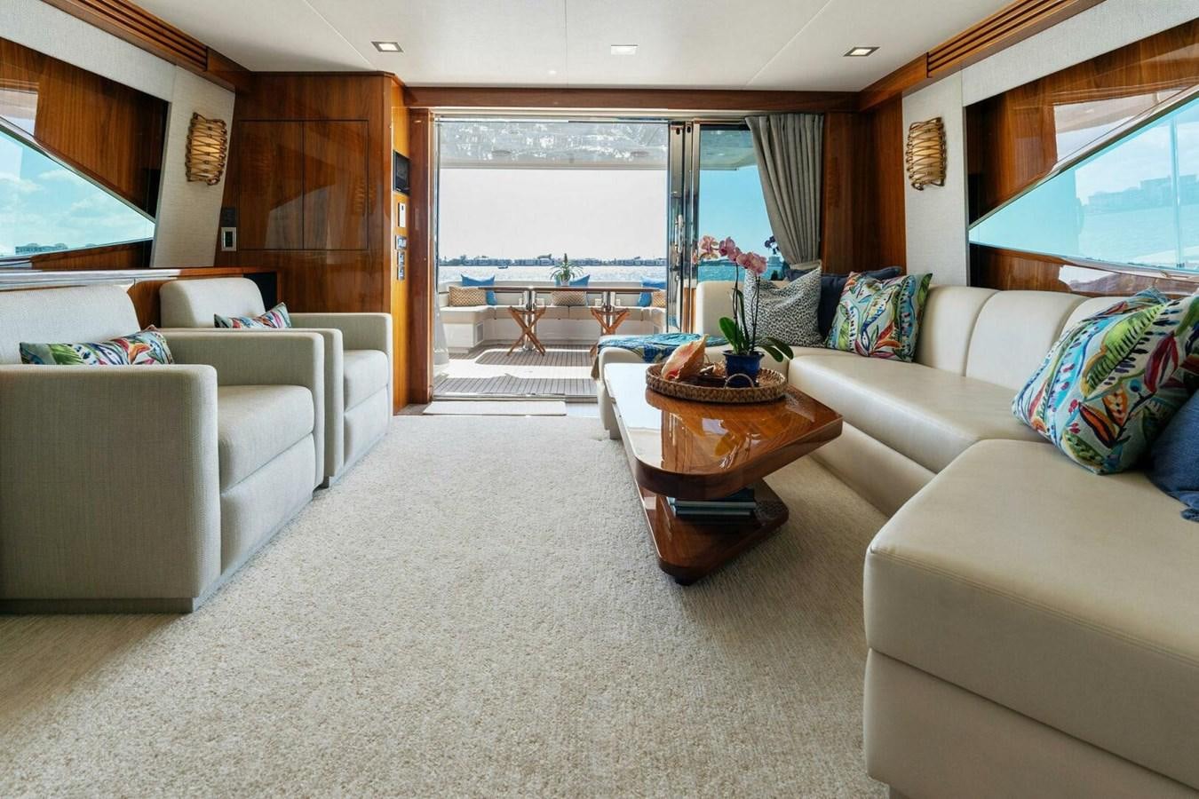 a living room with a large window aboard MANA Yacht for Sale