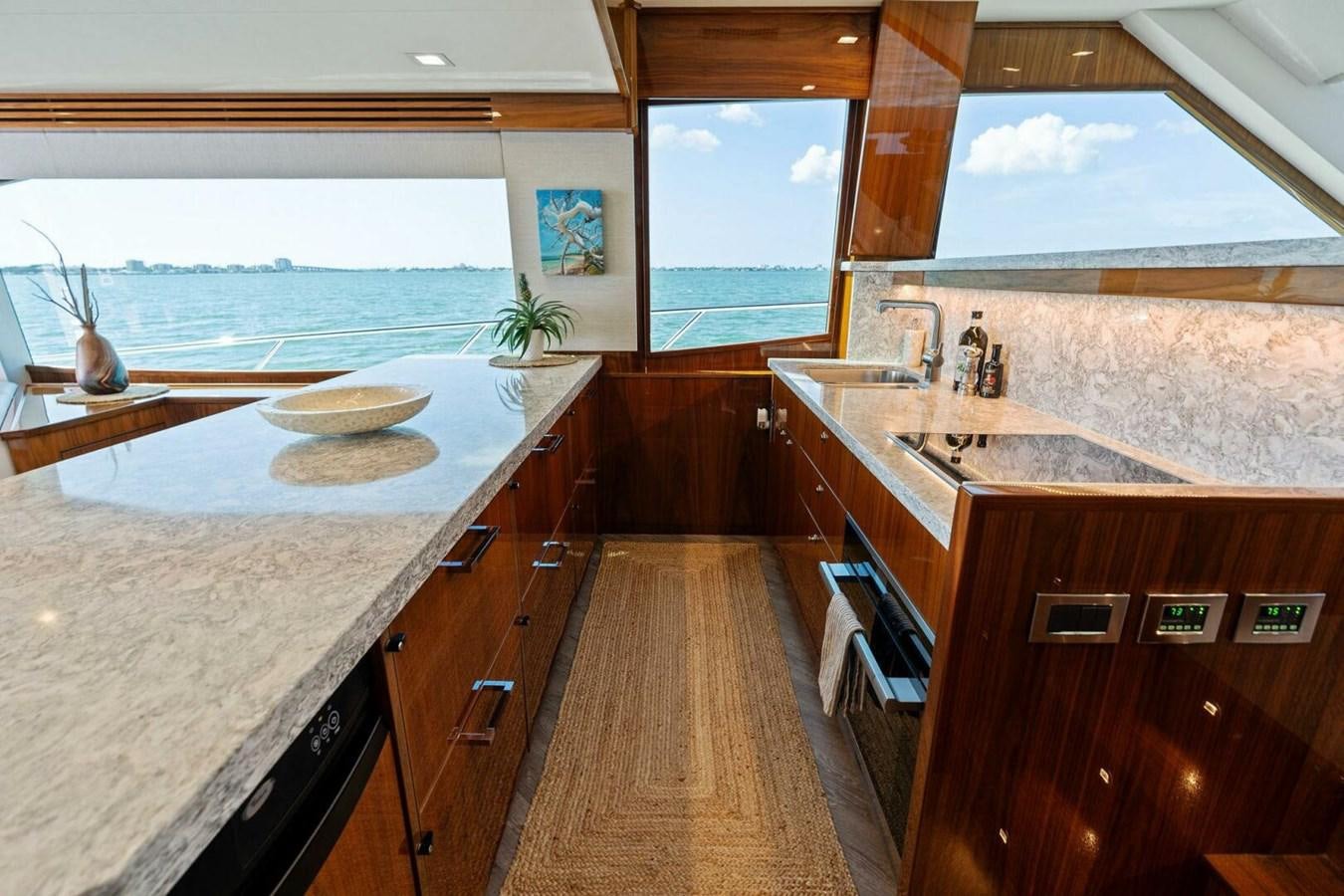 a kitchen with a large window aboard MANA Yacht for Sale