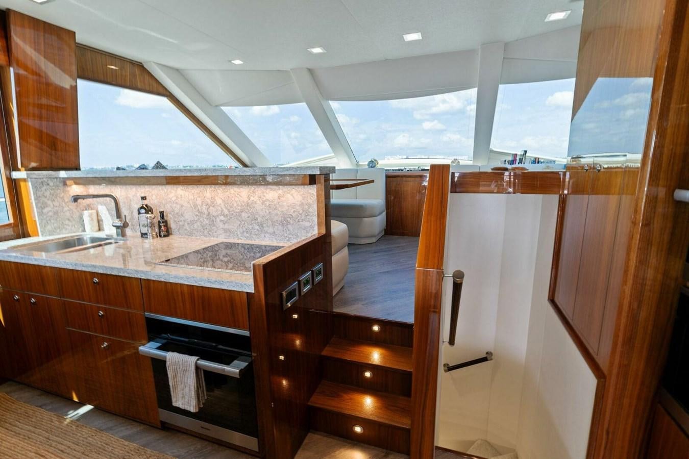 a kitchen with a large window aboard MANA Yacht for Sale