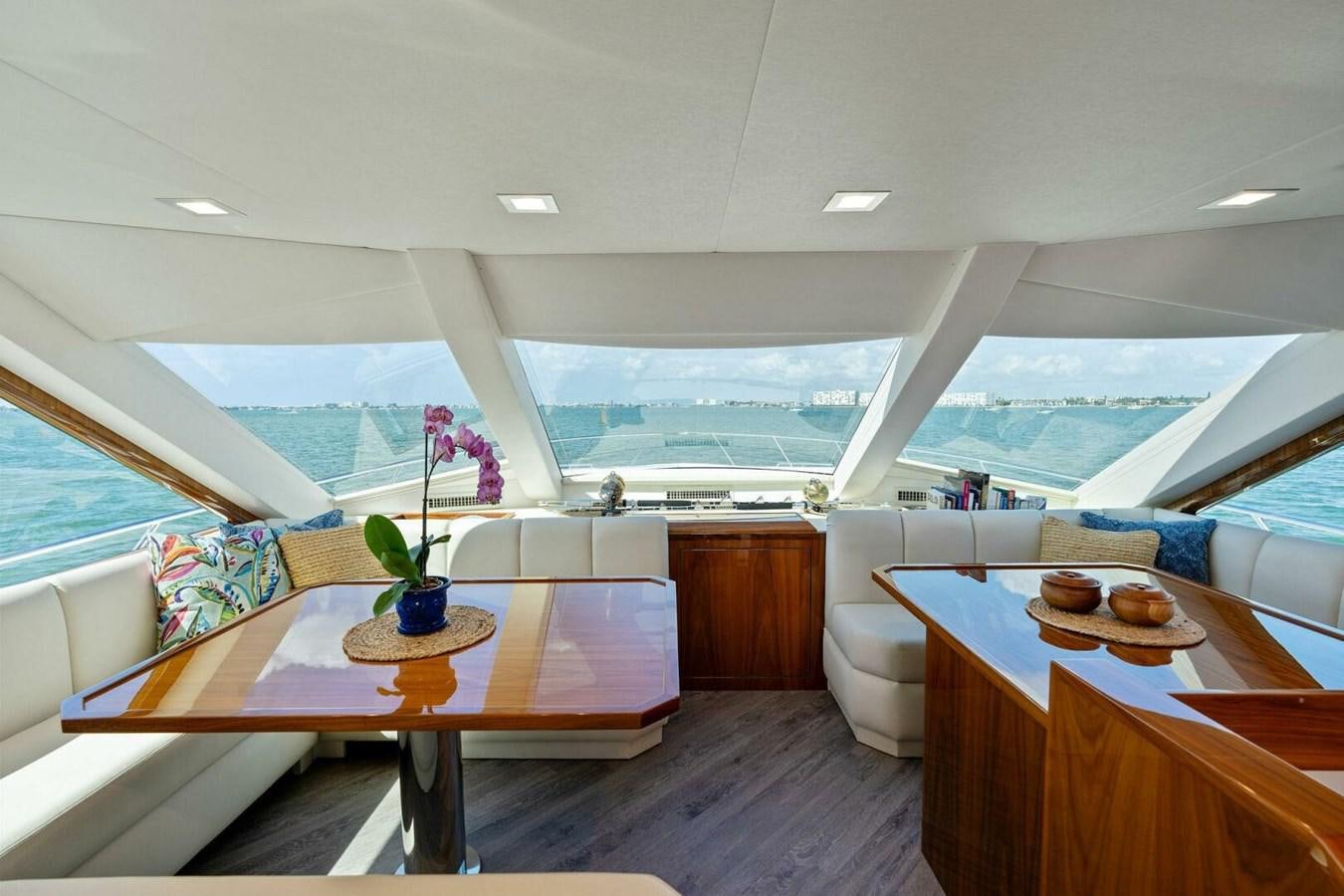 a room with a table and chairs aboard MANA Yacht for Sale
