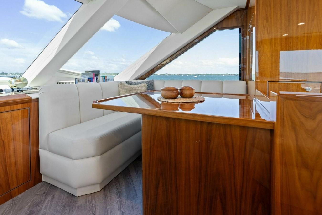 a room with a couch and a table aboard MANA Yacht for Sale