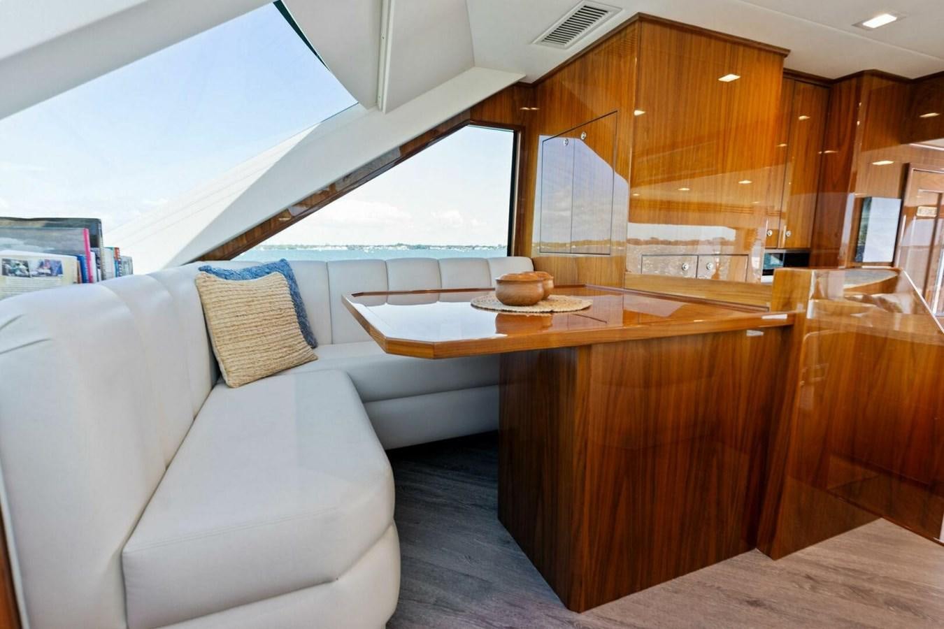 a room with a couch and a table aboard MANA Yacht for Sale