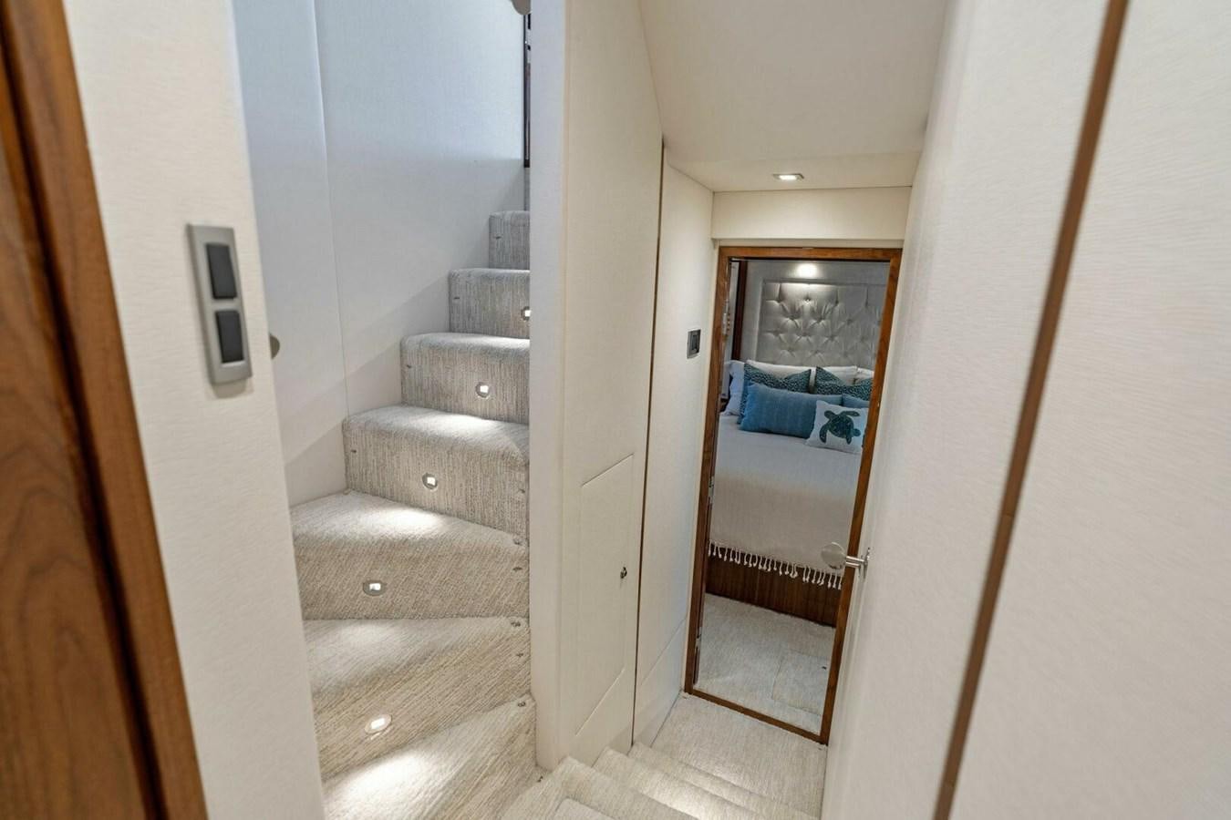 a person sitting in a chair in a hallway aboard MANA Yacht for Sale