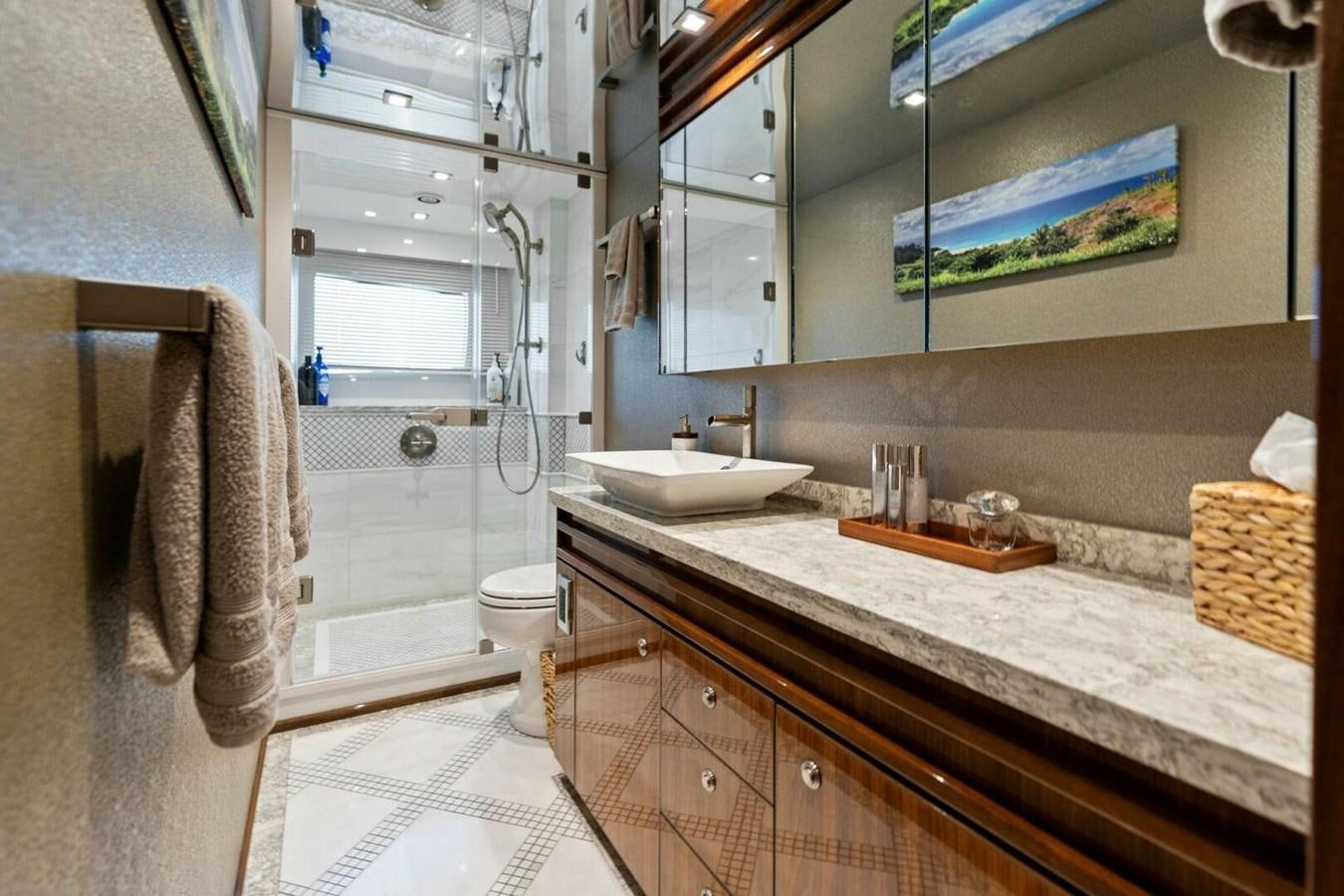 a bathroom with a sink and a mirror aboard MANA Yacht for Sale