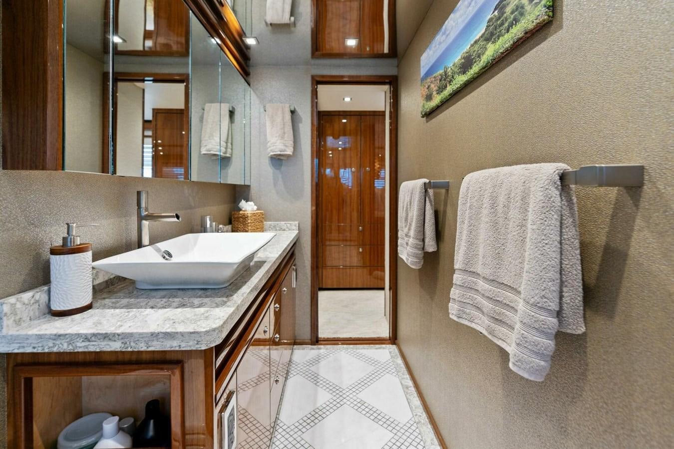 a bathroom with a sink and a mirror aboard MANA Yacht for Sale