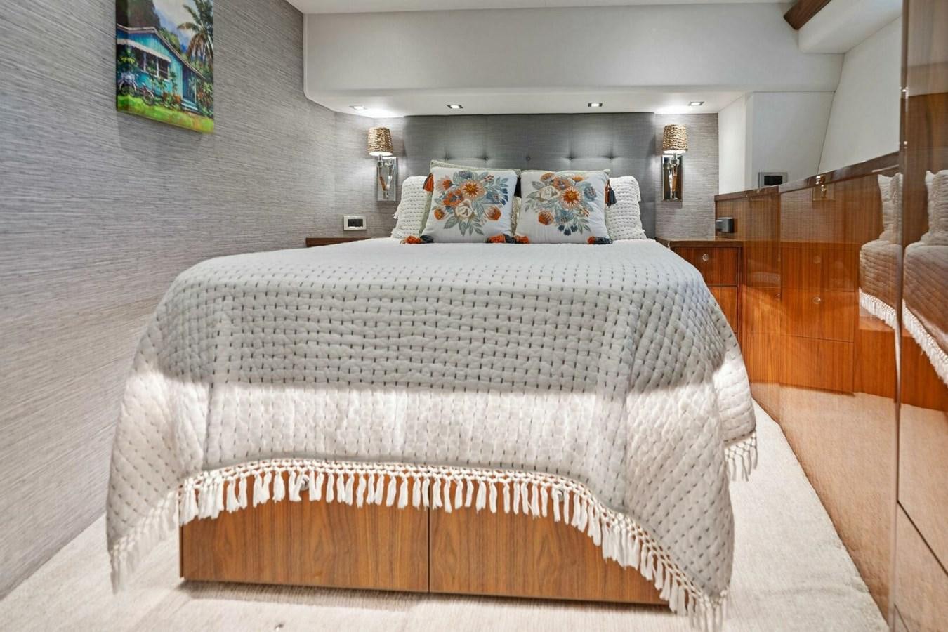 a bed with white sheets aboard MANA Yacht for Sale