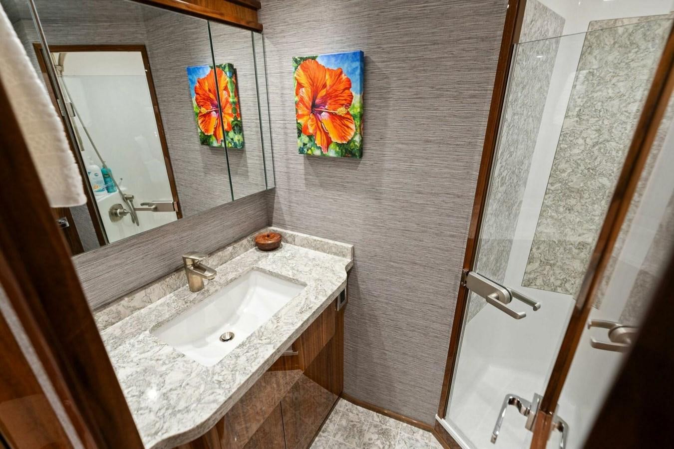 a bathroom with a sink and a mirror aboard MANA Yacht for Sale