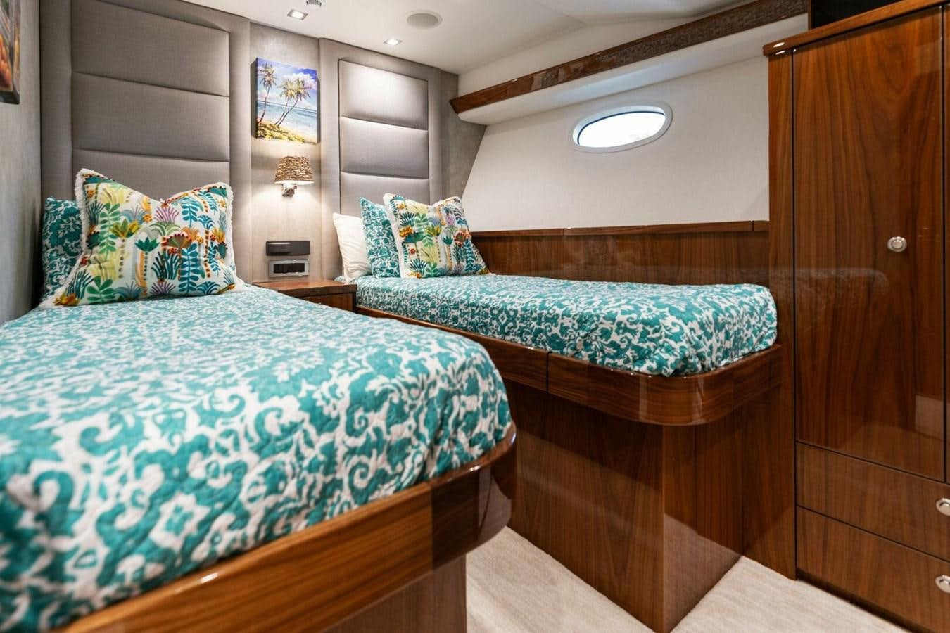 a couple of beds in a room aboard MANA Yacht for Sale