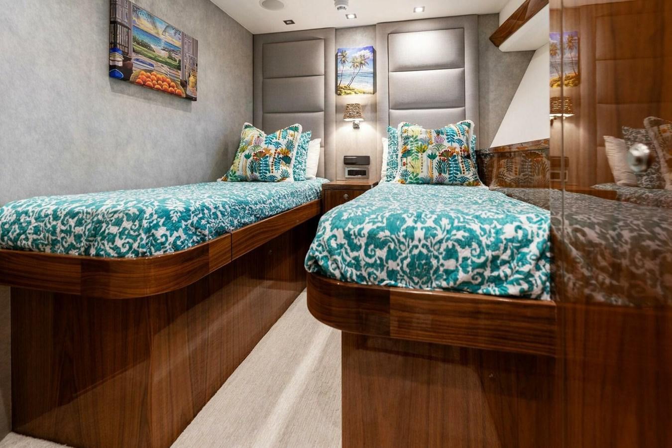 a couple of beds in a room aboard MANA Yacht for Sale