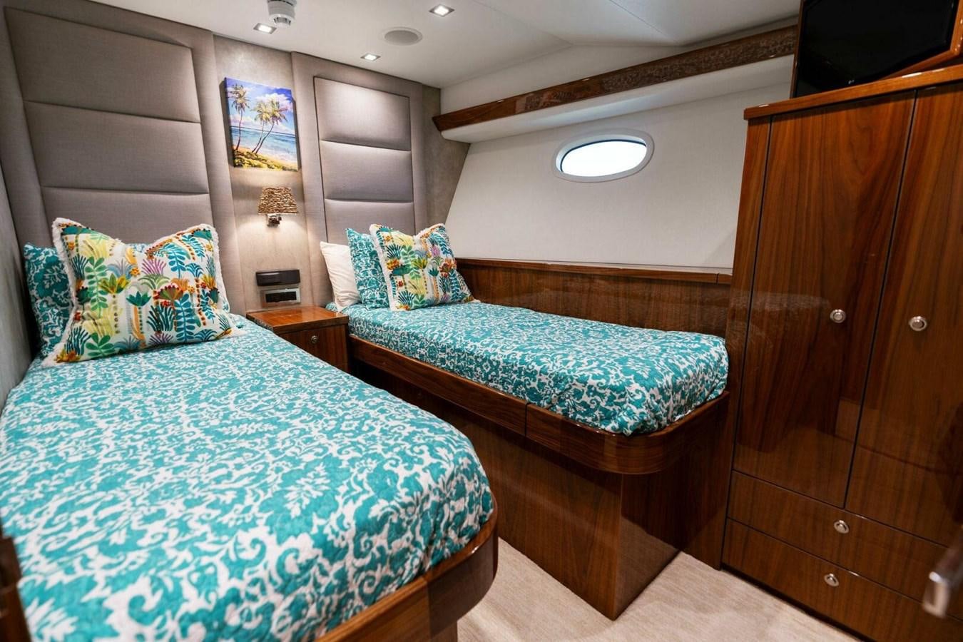 a couple of beds in a room aboard MANA Yacht for Sale
