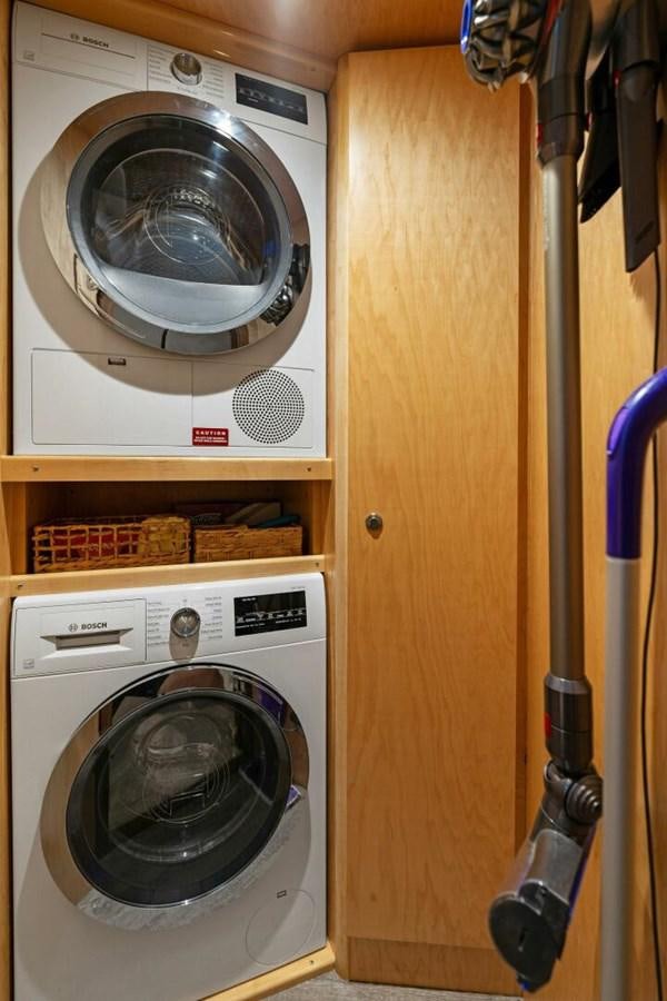 a dryer and dryer in a closet aboard MANA Yacht for Sale