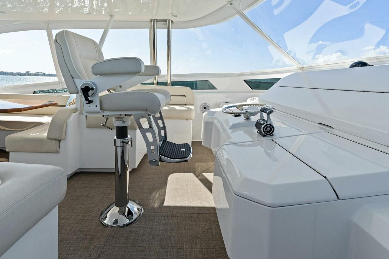 a room with a chair and a table and a bed aboard MANA Yacht for Sale