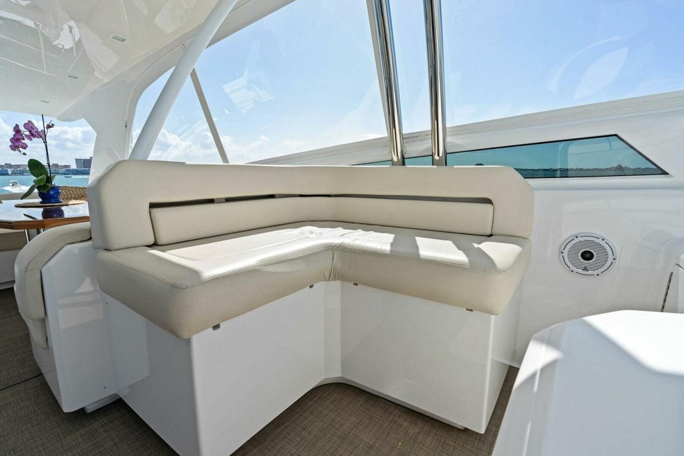 a white couch in a room aboard MANA Yacht for Sale