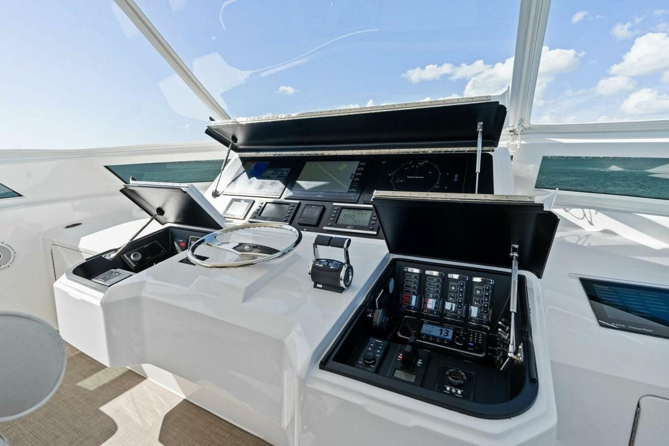a white desk with a black computer and a black printer on it aboard MANA Yacht for Sale