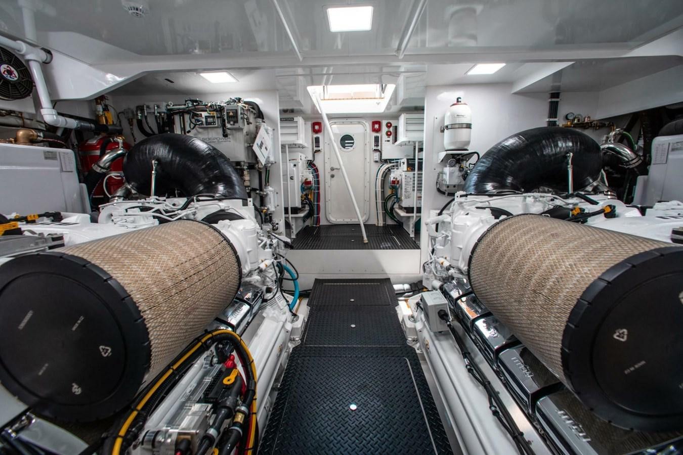 a large room with large tires aboard MANA Yacht for Sale