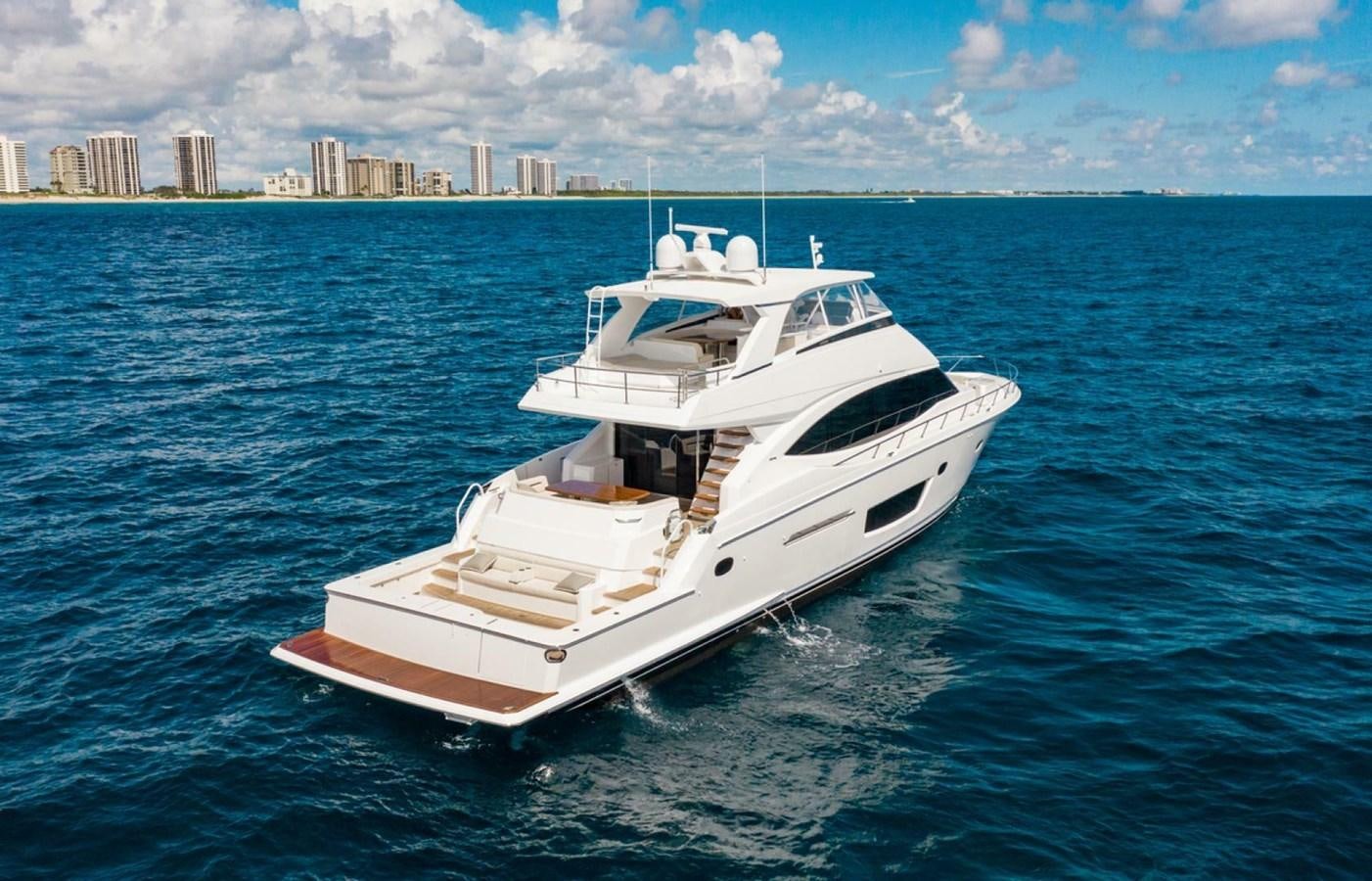 a white boat in the water aboard MANA Yacht for Sale