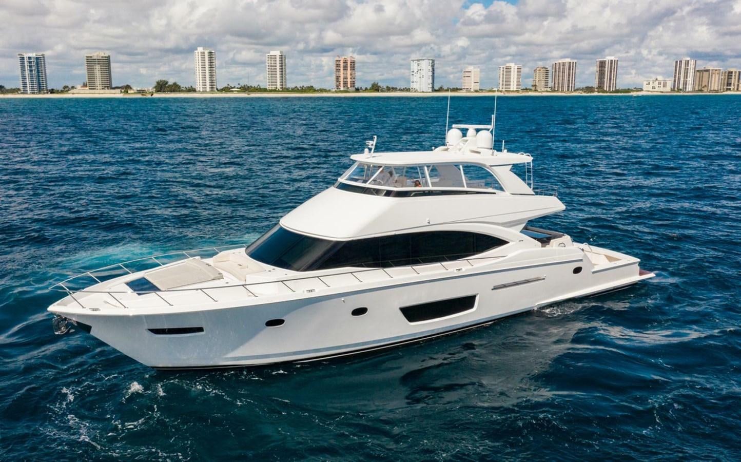 a white yacht in the water aboard MANA Yacht for Sale