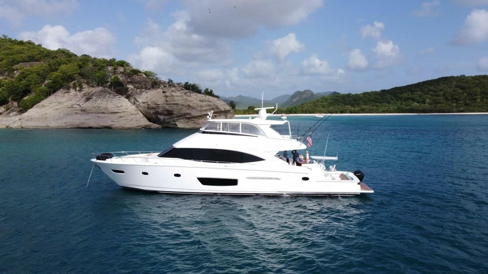 a white boat in the water aboard MANA Yacht for Sale