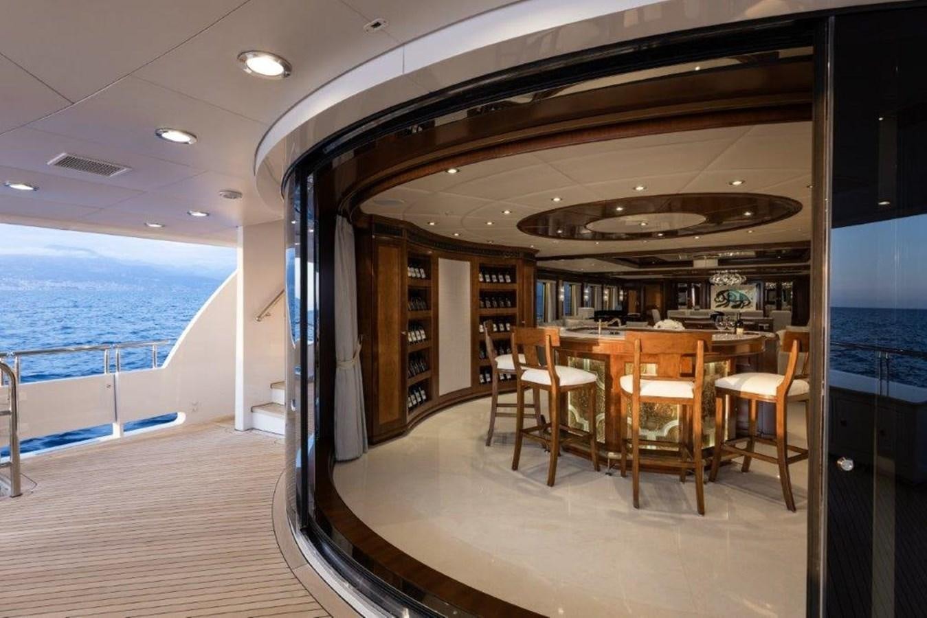 a room with a table and chairs aboard IRON BLONDE Yacht for Sale